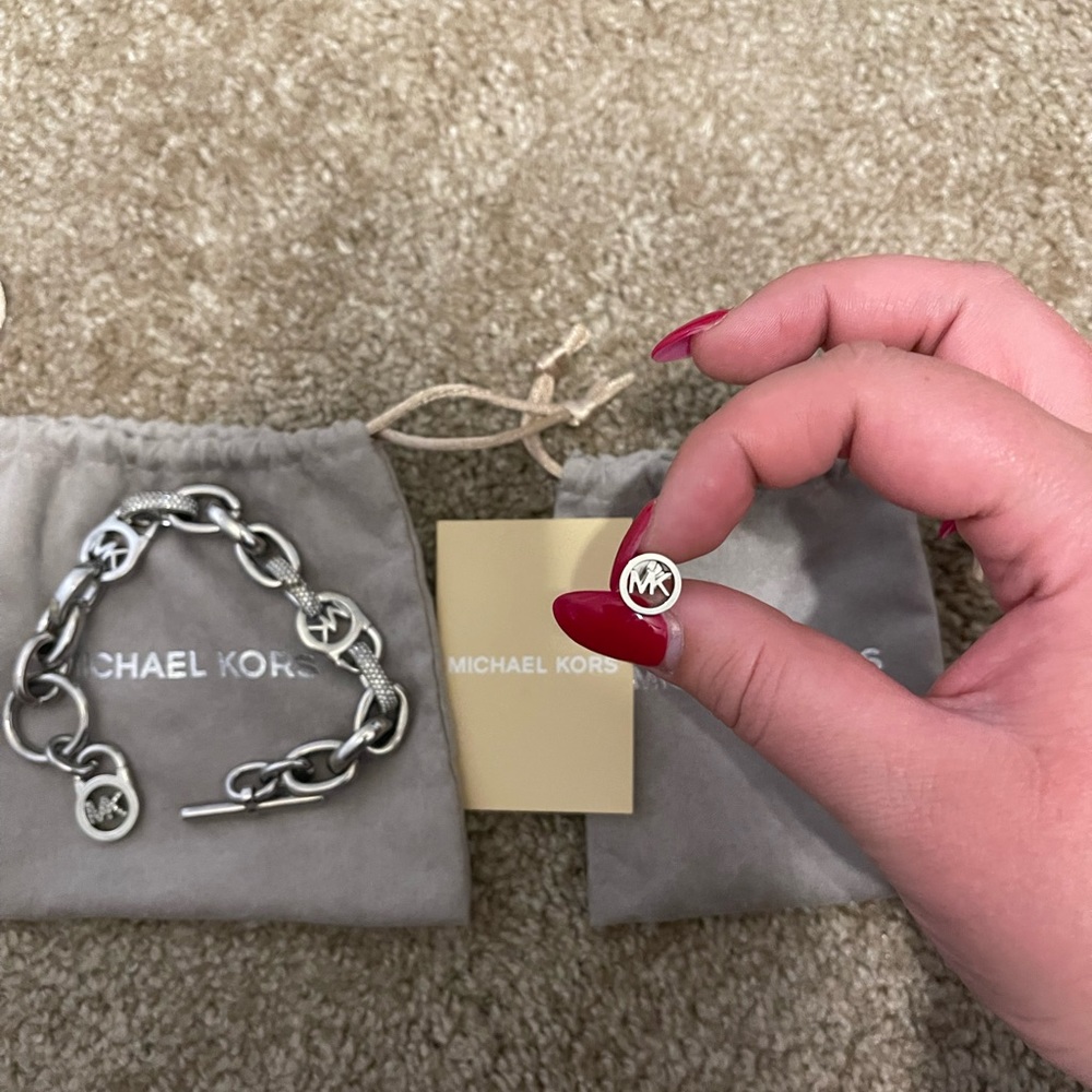 MAKE AN OFFER. 
Michael Kors charm bracelet and earrings set